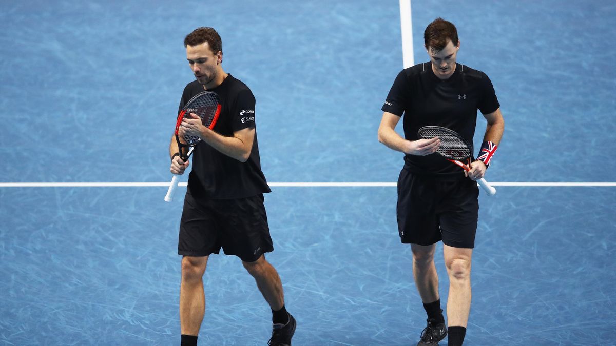 Jamie Murray of Great Britain and Bruno Soares of Brazil show their dejection during their straight sets defeat by Henri Kontinen of Finland and John Peers of Australia in their mens doubles semi final match at the Nitto ATP World Tour Finals at O2 Arena