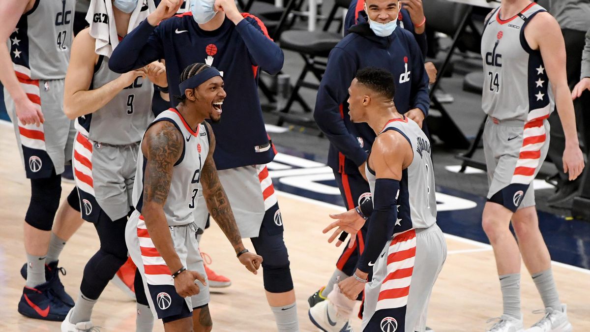 Russell Westbrook #4 of the Washington Wizards celebrates with Bradley Beal #3 after making the game-winning shot against the Brooklyn Nets