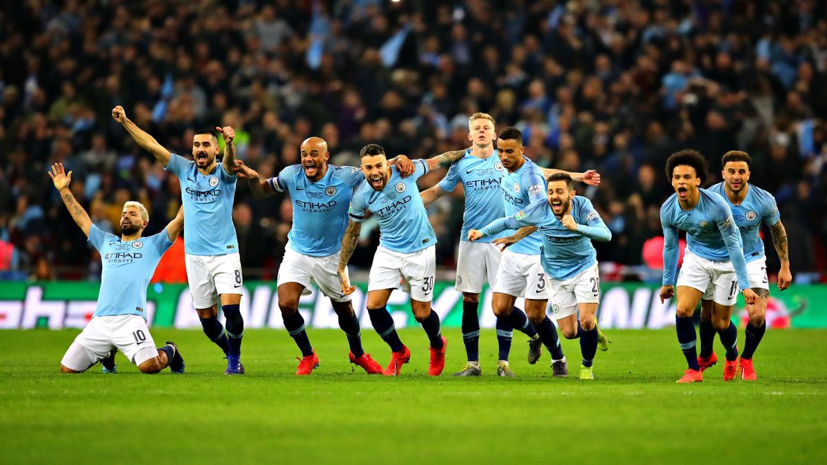 The Manchester City team celebrate after winning in the penalty shootout during the Carabao Cup Final between Chelsea and Manchester City at Wembley Stadium on February 24, 2019 in London, England