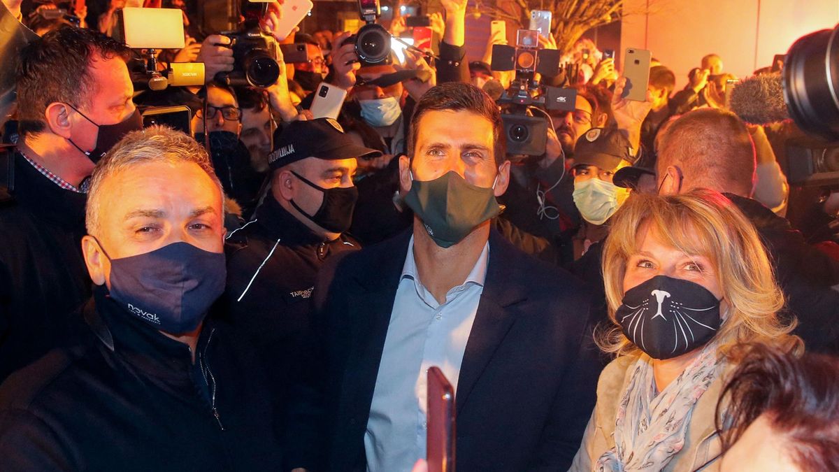 Novak Djokovic (C) accompanied by his parents celebrates 311 weeks as world number one with his family and supporters in front of family restaurant "Novak" on March 8, 2021 in Belgrade, Serbia