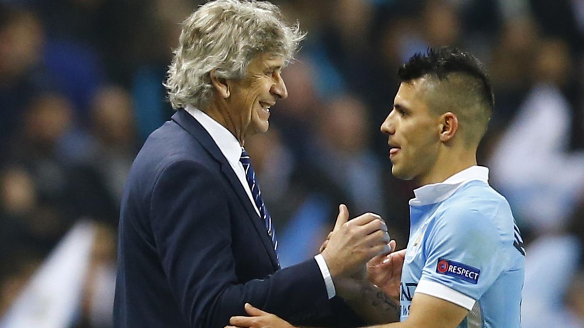Manchester City's Sergio Aguero is congratulated by manager Manuel Pellegrini as he is substituted.