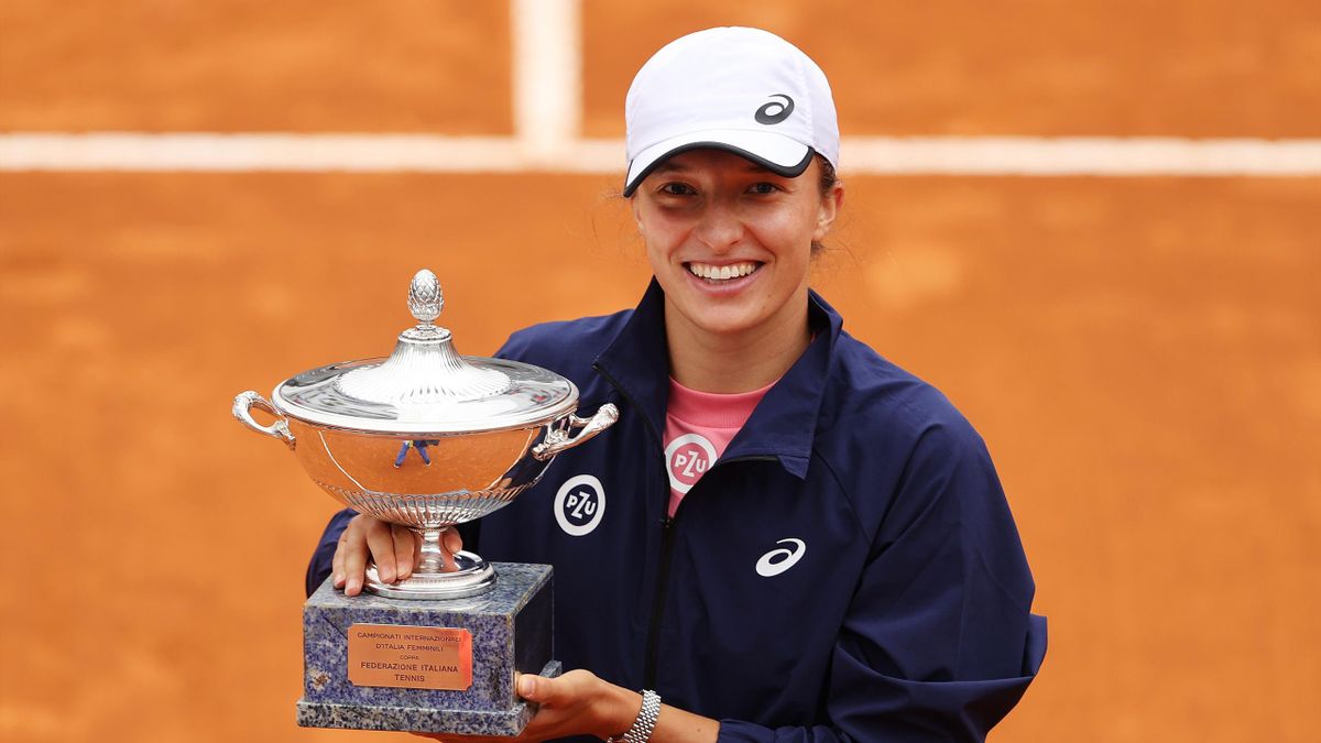 Iga Swiatek of Poland poses with the winners trophy after defeating Karolina Pliskova of the Czech Republic 6-0 6-0 in the women's final at Foro Italico on May 16, 2021 in Rome