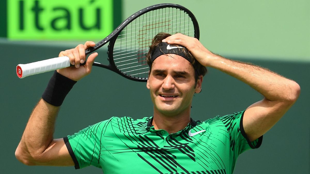 Roger Federer of Switzerland celebrates match point after defeating Rafael Nadal of Spain during the Men's Final and day 14 of the Miami Open at Crandon Park Tennis Center