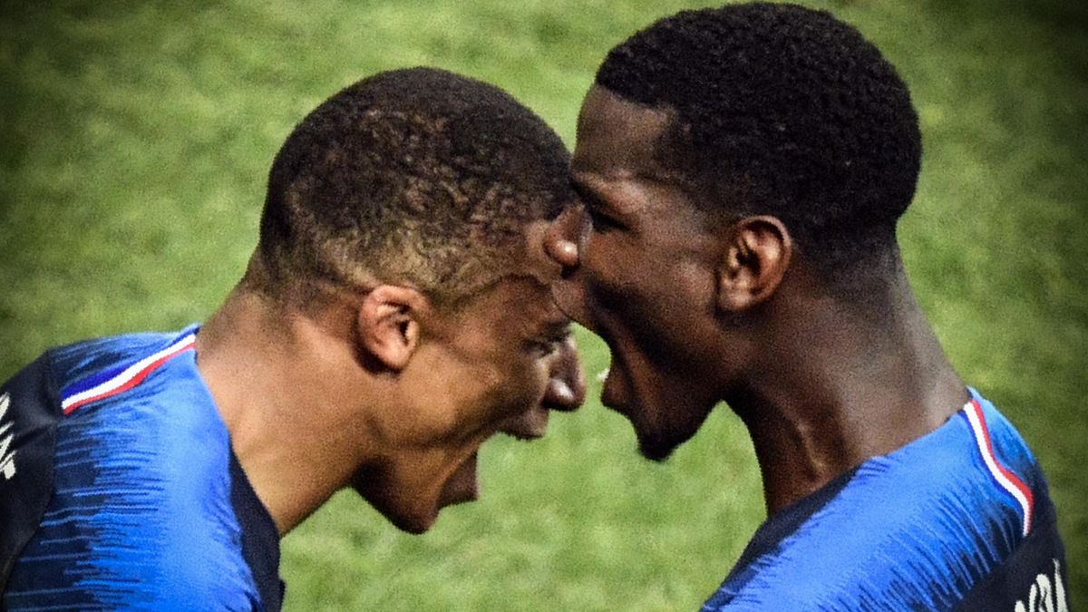 TOPSHOT - France's forward Kylian Mbappe (L) and France's midfielder Paul Pogba (R) celebrate after they both scored a goal during the Russia 2018 World Cup final football match between France and Croatia at the Luzhniki Stadium in Moscow on July 15, 2018