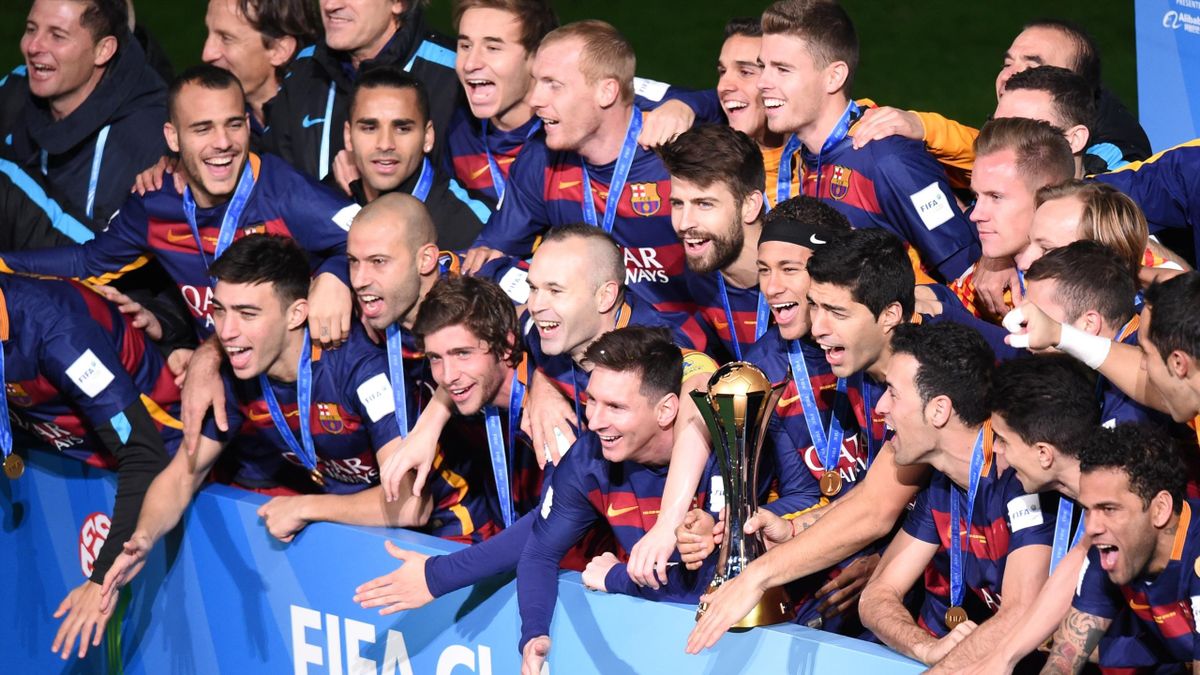 Barcelona celebrate winning the FIFA Club World Cup Final with the trophy