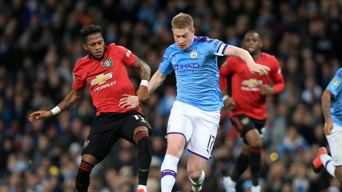 Fred of Man Utd battles with Kevin de Bruyne of Man City during the Carabao Cup Semi Final match between Manchester City and Manchester United at the Etihad Stadium on January 29, 2020 in Manchester, England