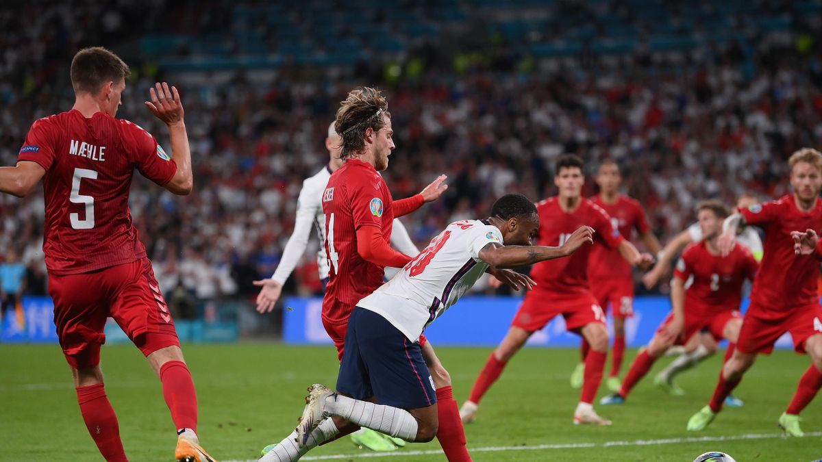 : Raheem Sterling of England is fouled by Mathias Jensen of Denmark inside the penalty area, leading to England being awarded a penalty during the UEFA Euro 2020 Championship Semi-final match between England and Denmark at Wembley Stadium on July 07, 2021