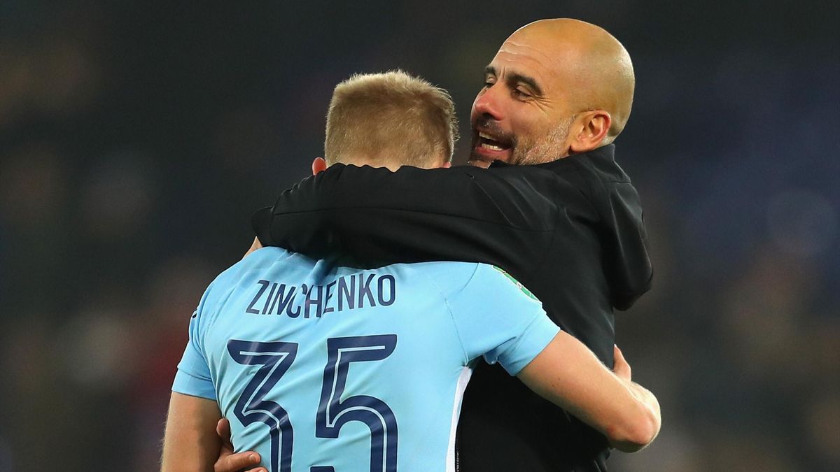 Oleksandr Zinchenko of Manchester City and Josep Guardiola, Manager of Manchester City celebrate penalty shoot out victory after the Carabao Cup Quarter-Final match between Leicester City and Manchester City at The King Power Stadium on December 19, 2017