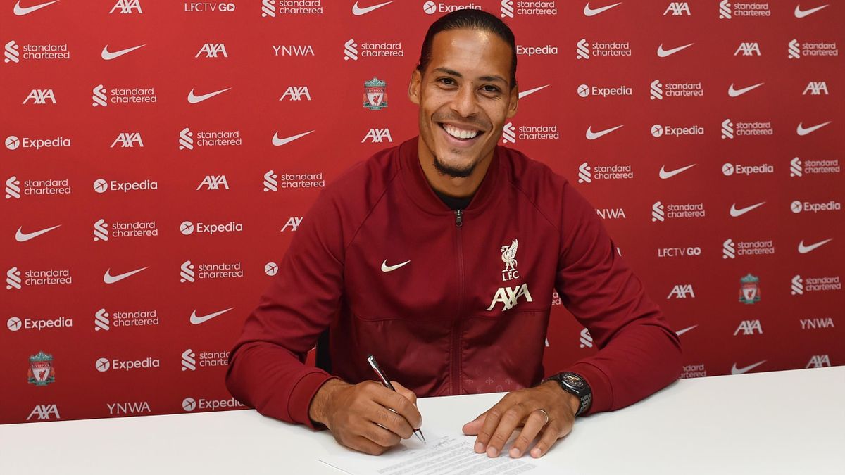 Virgil van Dijk of Liverpool signing a new contact for Liverpool Football Club at Anfield on August 13, 2021 in Kirkby, England.