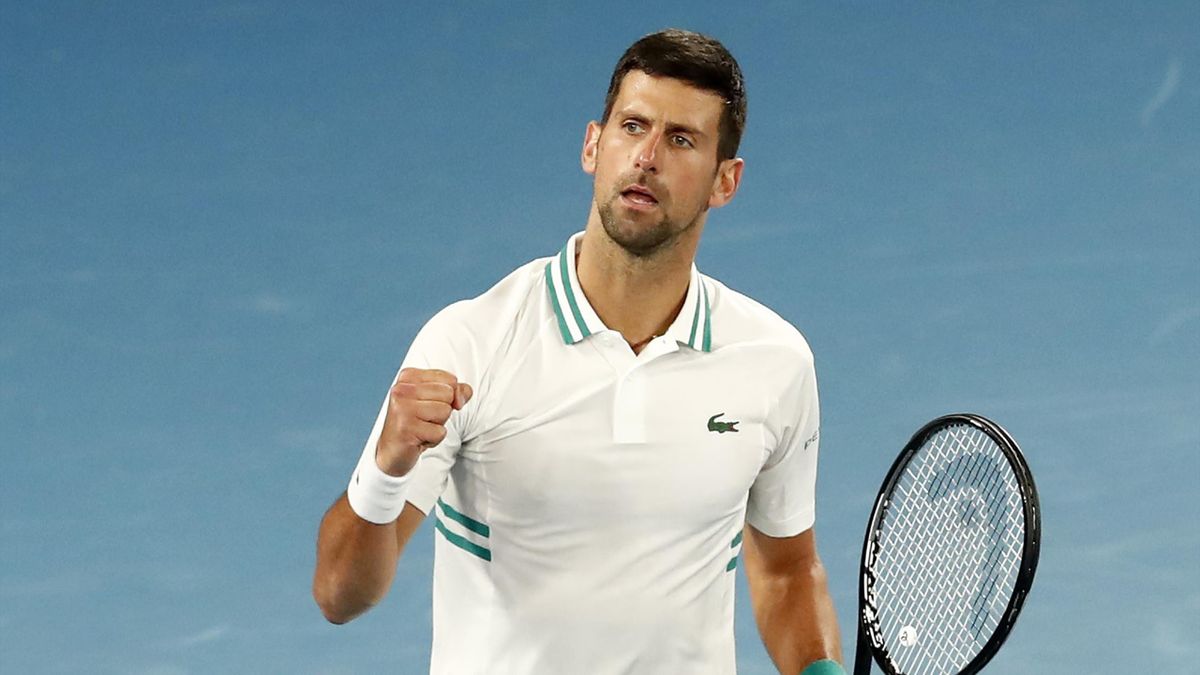 Novak Djokovic of Serbia celebrates match point in his Men's Singles fourth round match against Milos Raonic of Canada during day seven of the 2021 Australian Open at Melbourne Park