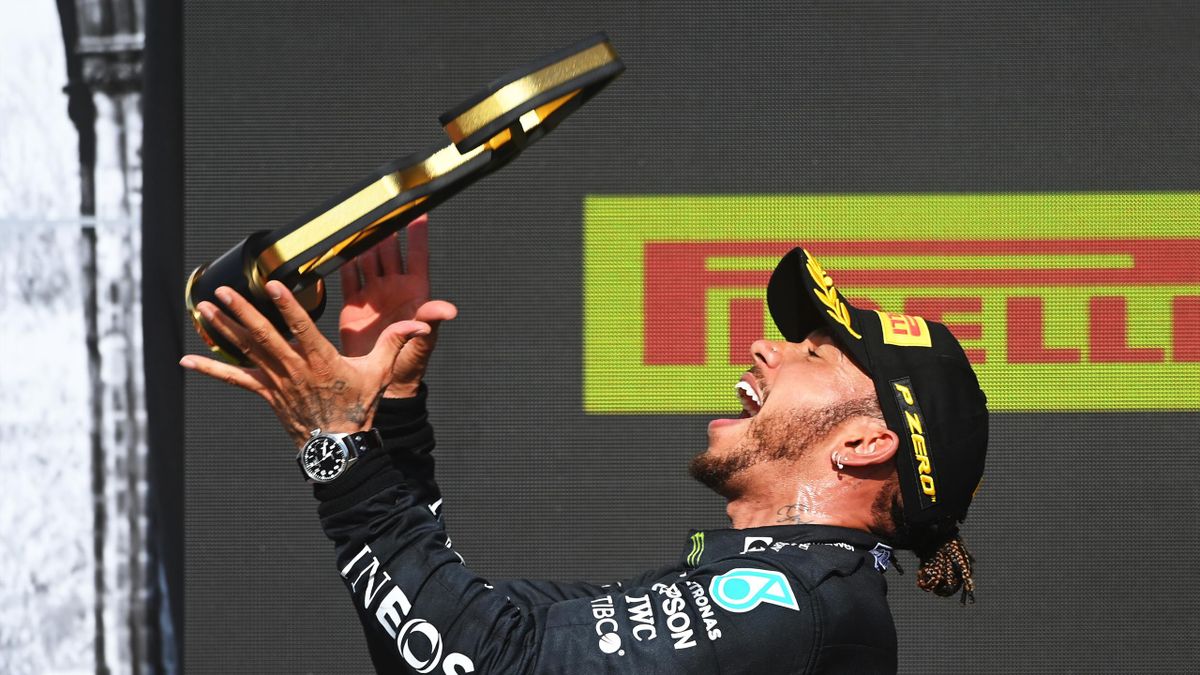 NORTHAMPTON, ENGLAND - JULY 18: Race winner Lewis Hamilton of Great Britain and Mercedes GP celebrates on the podium during the F1 Grand Prix of Great Britain at Silverstone on July 18, 2021 in Northampton, England.