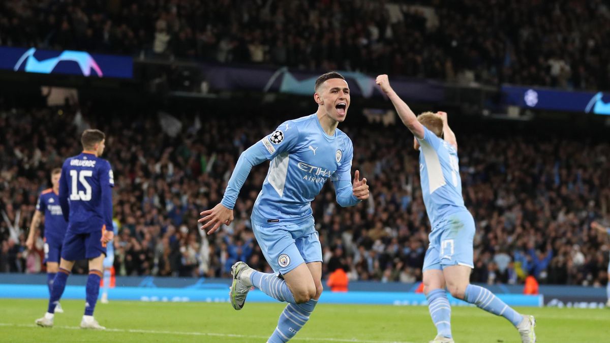 MANCHESTER, ENGLAND - APRIL 26: Phil Foden of Manchester City celebrates after scoring a goal to make it 3-1 during the UEFA Champions League Semi Final Leg One match between Manchester City and Real Madrid at City of Manchester Stadium on April 26, 2022