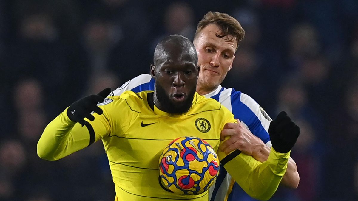Chelsea's Belgian striker Romelu Lukaku (L) vies with Brighton's English defender Dan Burn (R) during the English Premier League football match between Brighton and Hove Albion and Chelsea at the American Express Community Stadium in Brighton, southern En