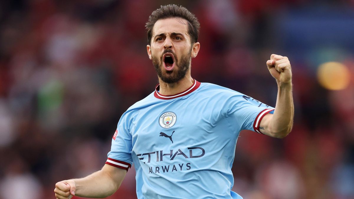 Bernardo Silva of Manchester City celebrates the first goal of his team scored by teammate Julian Alvarez (not in frame) during The FA Community Shield between Manchester City and Liverpool