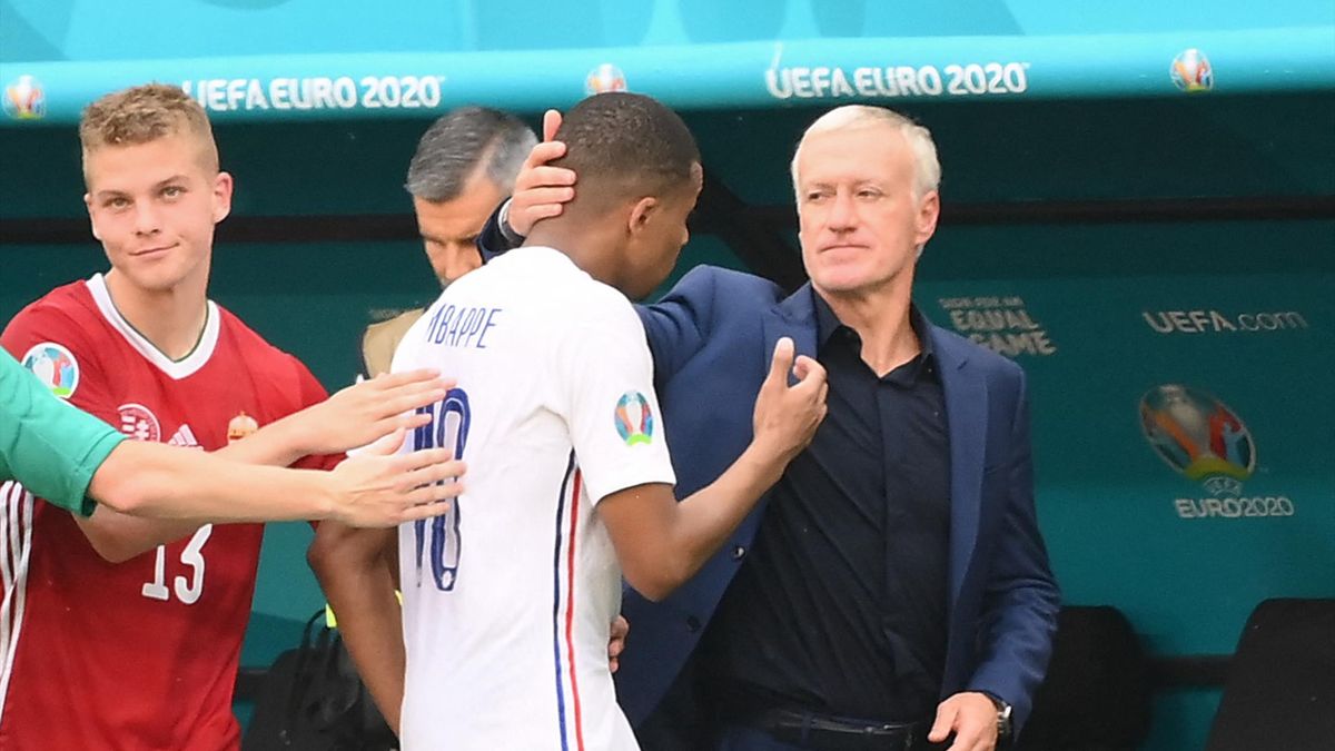 France's coach Didier Deschamps greets France's forward Kylian Mbappe after the UEFA EURO 2020 Group F football match between Hungary and France at Puskas Arena in Budapest on June 19, 2021.