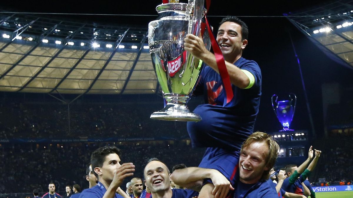 Best sporting pictures of 2015 - Barcelona v Juventus - UEFA Champions League Final - Olympiastadion, Berlin, Germany, 6/6/15: Barcelona's Xavi celebrates with the trophy and team mates after winning the UEFA Champions League