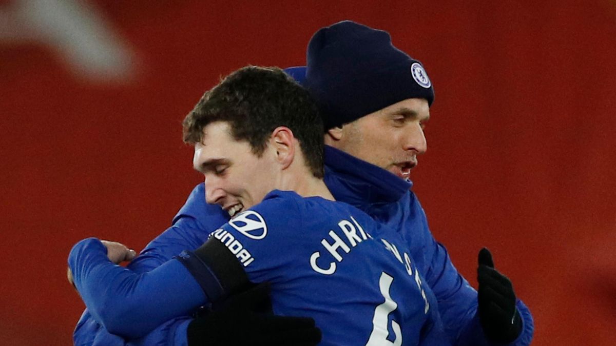 Chelsea's German head coach Thomas Tuchel (R) embraces Chelsea's Danish defender Andreas Christensen (L) at the end of the English Premier League football match between Liverpool and Chelsea at Anfield in Liverpool, north west England on March 4, 2021. (