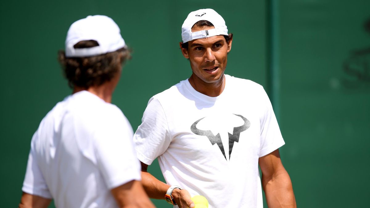 Rafael Nadal of Spain (R) speaks with coach, Francisco Roig in a practice session during Day Ten of The Championships - Wimbledon 2019 at All England Lawn Tennis and Croquet Club on July 11, 2019 in London, England.