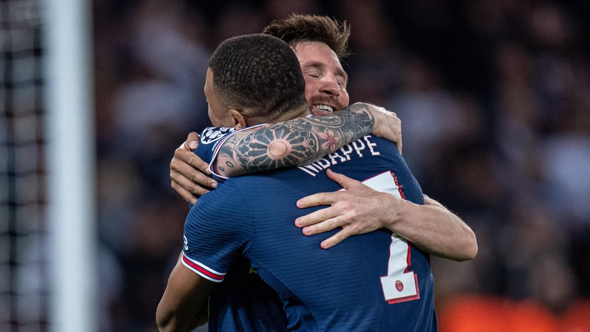 Kylian Mbappe and Lionel Messi embrace after a