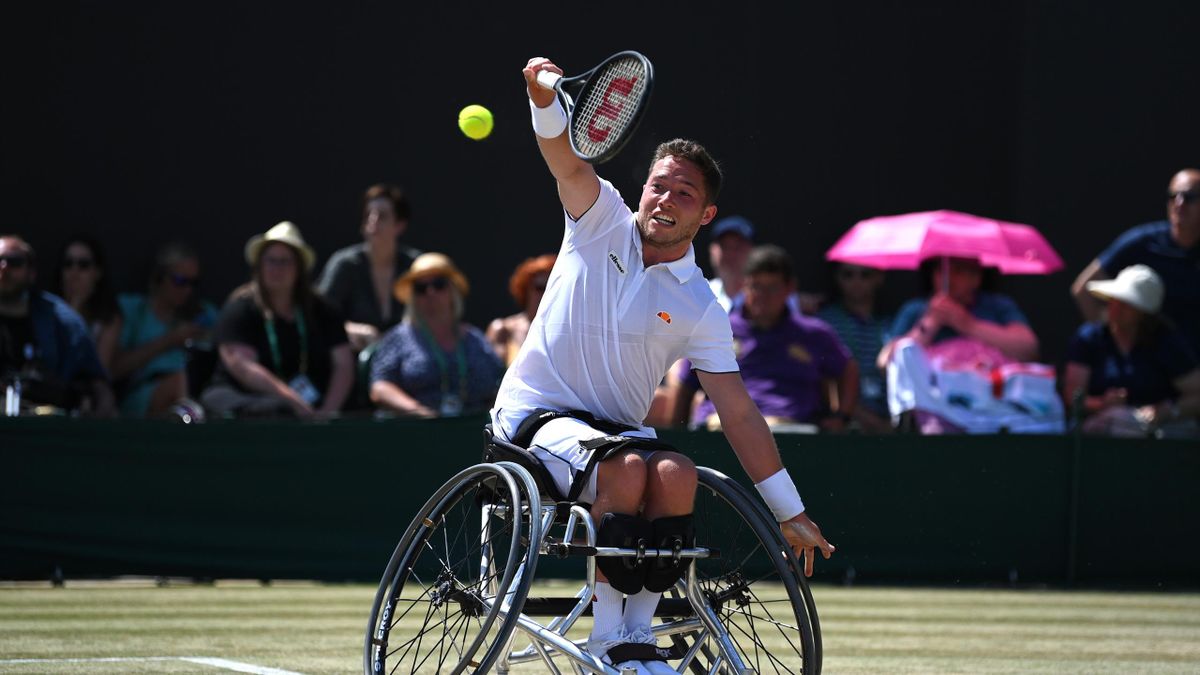 Alfie Hewett of Great Britain plays a forehand against Shingo Kunieda of Japan during their Men's Wheelchair Singles Final match on day fourteen of The Championships Wimbledon 2022 at All England Lawn Tennis and Croquet Club on July 10, 2022 in London.
