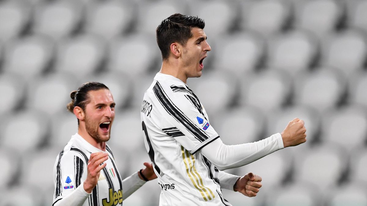 Alvaro Morata of Juventus celebrates with Adrien Rabiot after scoring their team's third goal from the penalty spot during the Serie A match between Juventus and SS Lazio at Allianz Stadium on March 06, 2021 in Turin, Italy.