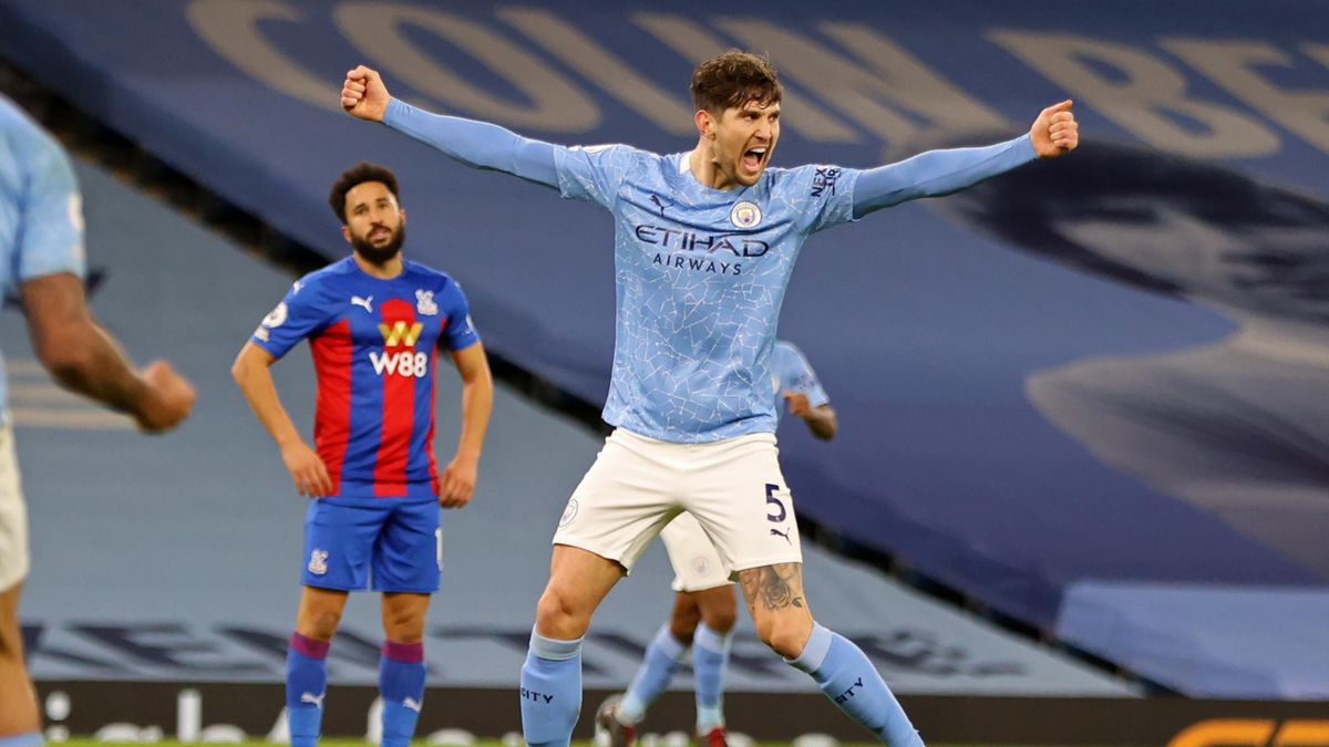 Manchester City's English defender John Stones celebrates after scoring their third goal during the English Premier League football match between Manchester City and Crystal Palace at the Etihad Stadium