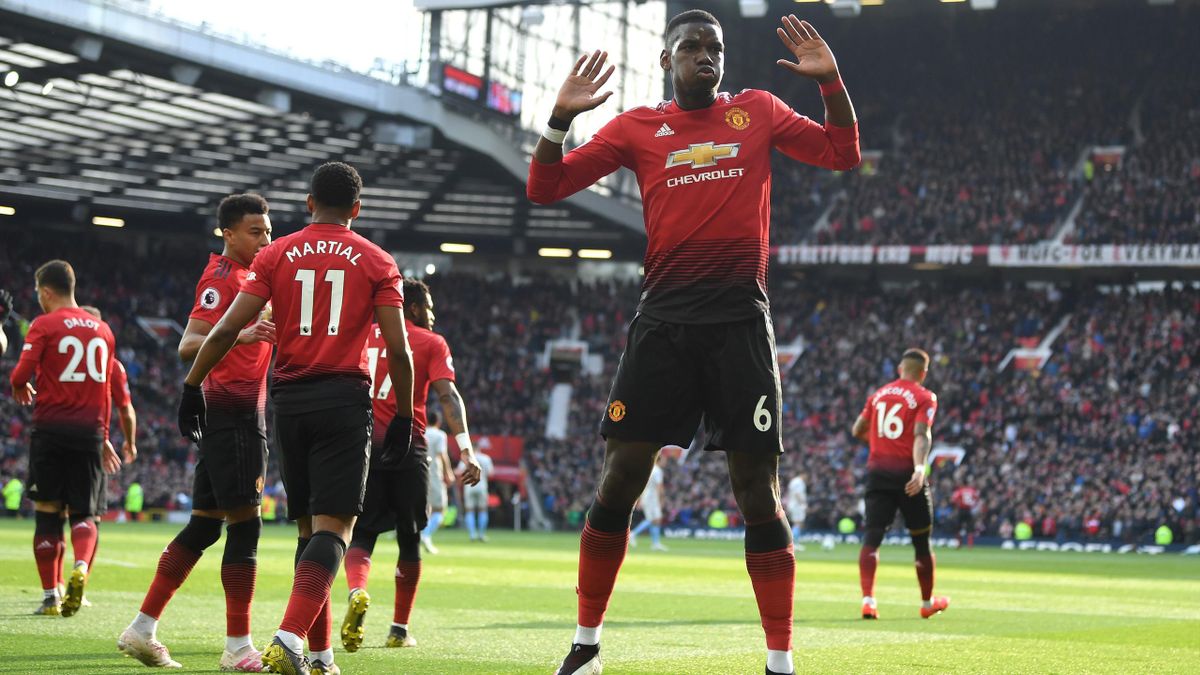 Paul Pogba of Manchester United celebrates as he scores his team's first goal from the penalty spot during the Premier League match between Manchester United and West Ham United at Old Trafford on April 13, 2019 in Manchester, United Kingdom