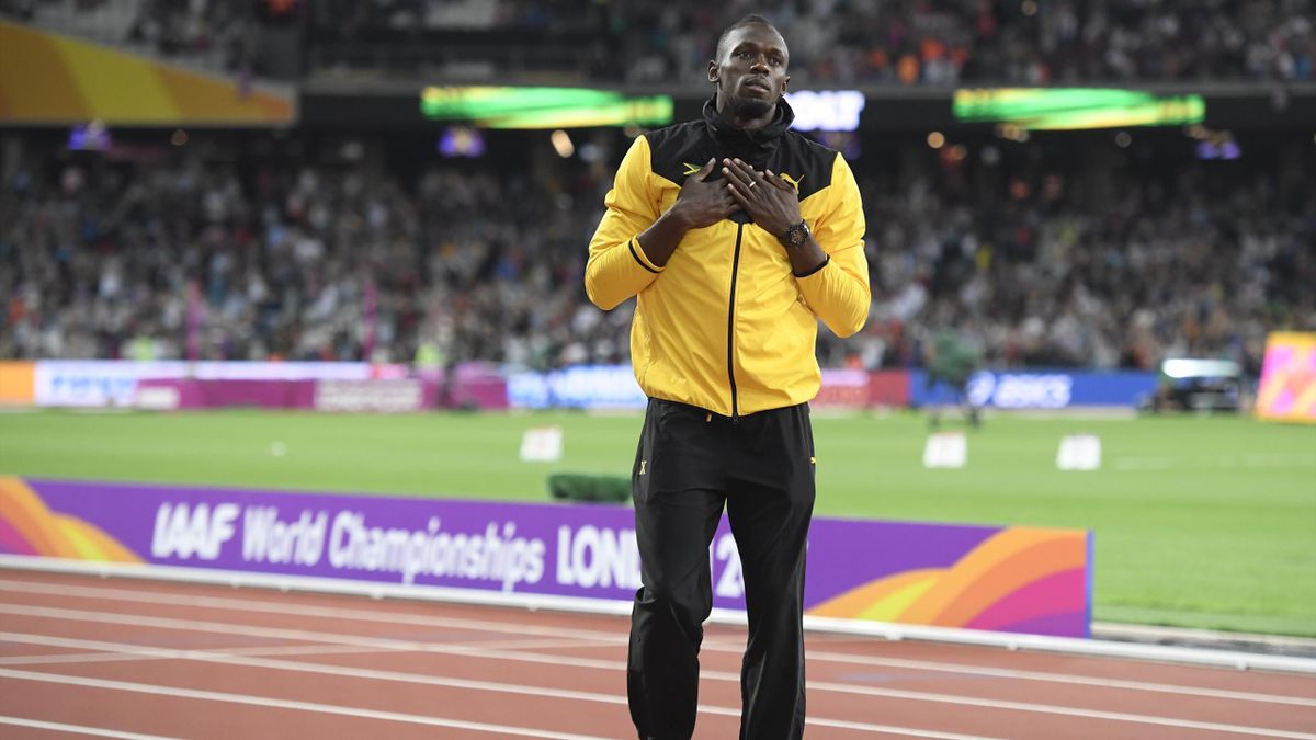 Usain Bolt of Jamaica gestures after hobbling out of his final race at the World Championships in London