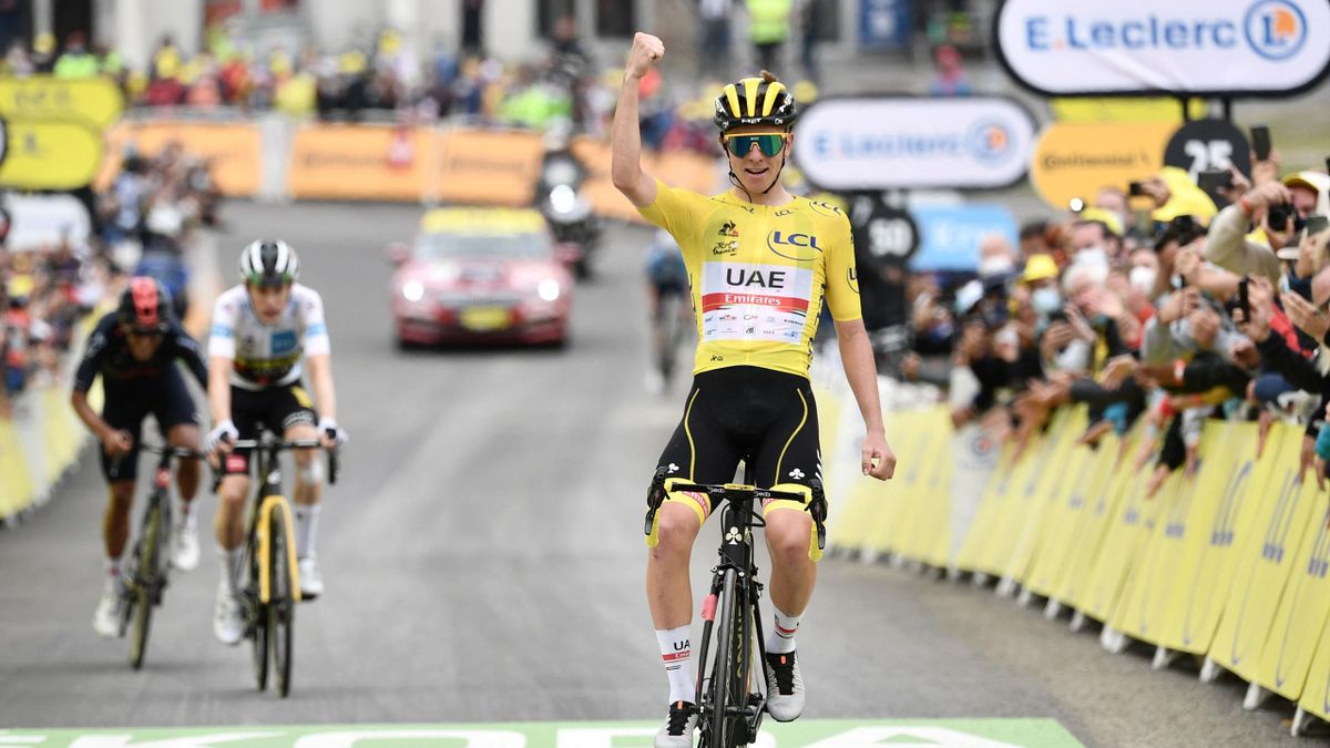 Team UAE Emirates' Tadej Pogacar of Slovenia wearing the overall leader's yellow jersey celebrates as he crosses the finish line during the 18th stage of the 108th edition of the Tour de France cycling race, 129 km between Pau and Luz Ardiden, on July 15,