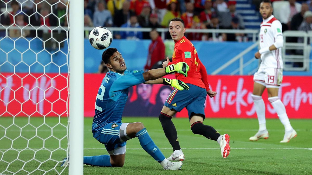 Iago Aspas of Spain back heels in past Monir El Kajoui of Morocco to score his sides second goal during the 2018 FIFA World Cup Russia group B match between Spain and Morocco at Kaliningrad Stadium on June 25, 2018 in Kaliningrad, Russia