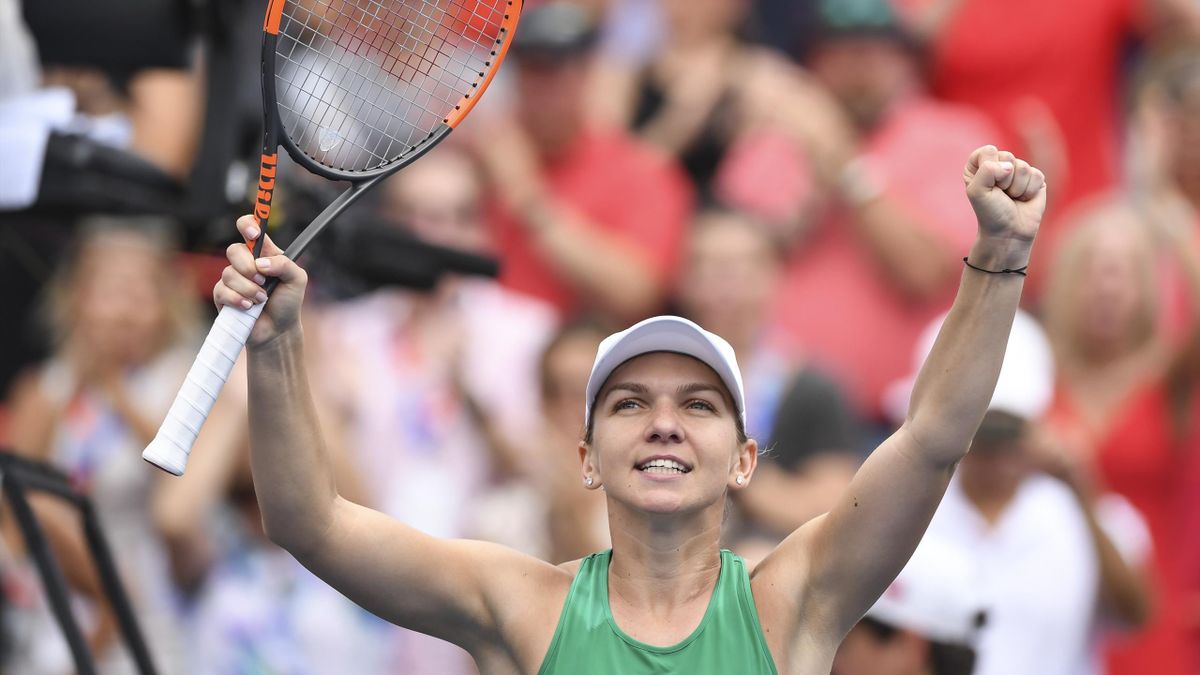 Simona Halep of Romania celebrates after defeating Anastasia Pavlyuchenkova of Russia 7-6, 4-6, 7-5 during day four of the Rogers Cup at IGA Stadium on August 9, 2018 in Montreal, Quebec, Canada.