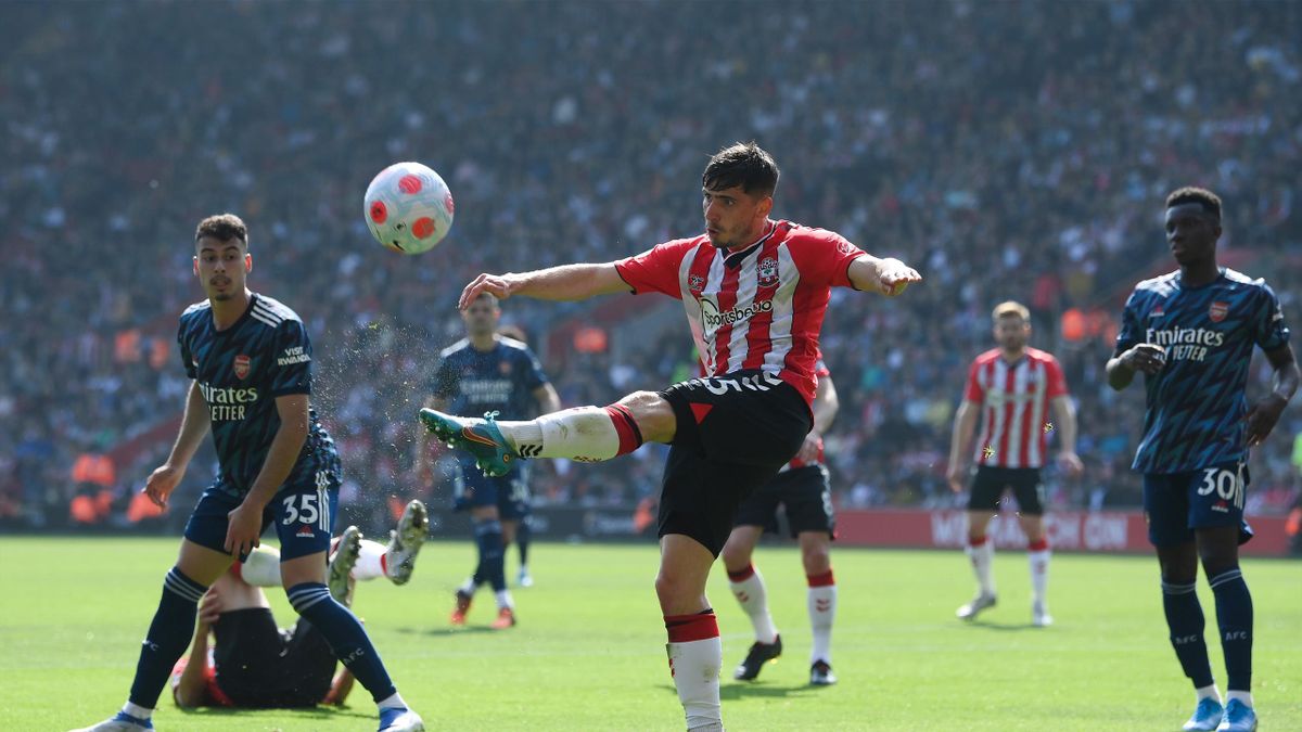 SOUTHAMPTON, ENGLAND - APRIL 16: Romain Perraud of Southampton clears the ball during the Premier League match between Southampton and Arsenal at St Mary's Stadium on April 16, 2022 in Southampton, England. (Photo by Mike Hewitt/Getty Images)