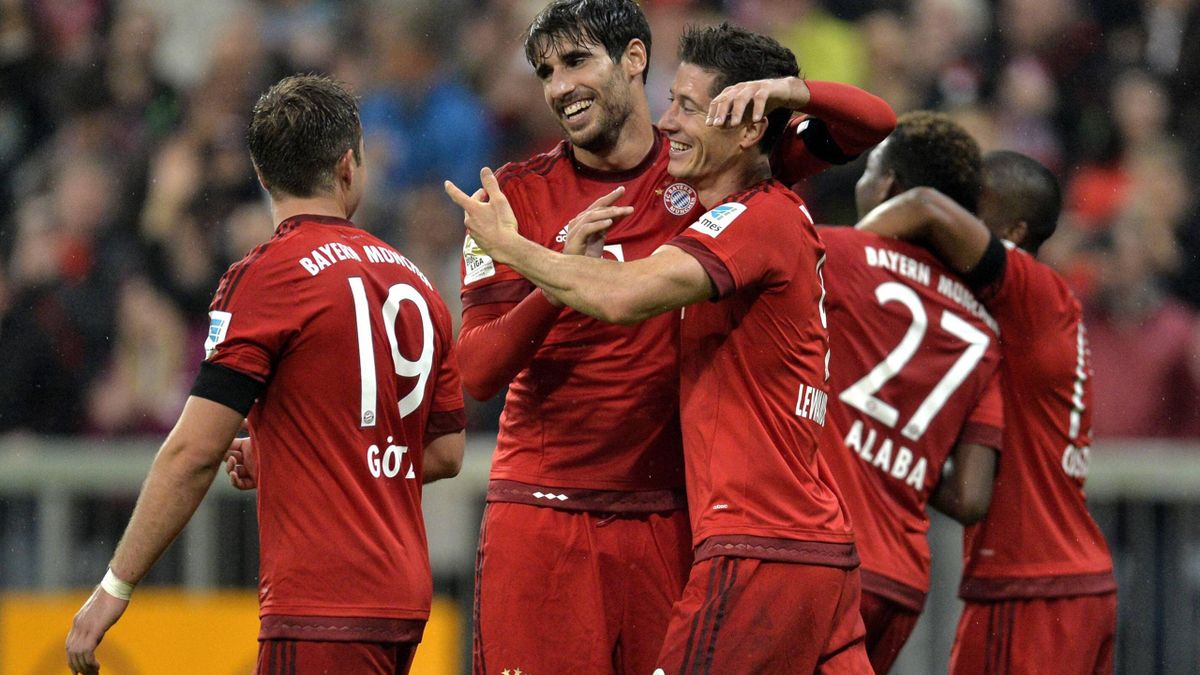 Robert Lewandowski celebrates one of his five goals for Bayern v Wolfsburg