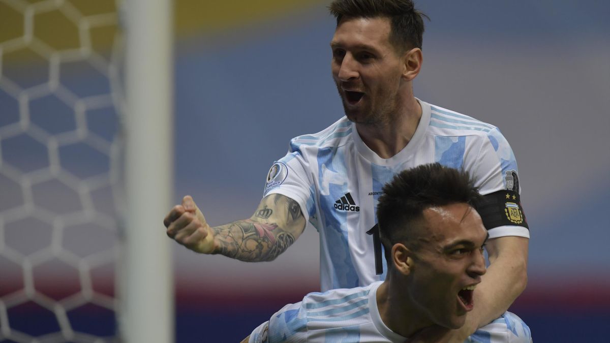 Lautaro Martinez of Argentina celebrates with teammate Lionel Messi after scoring the first goal of his team during a semi-final match of Copa America Brazil 2021 between Argentina and Colombia