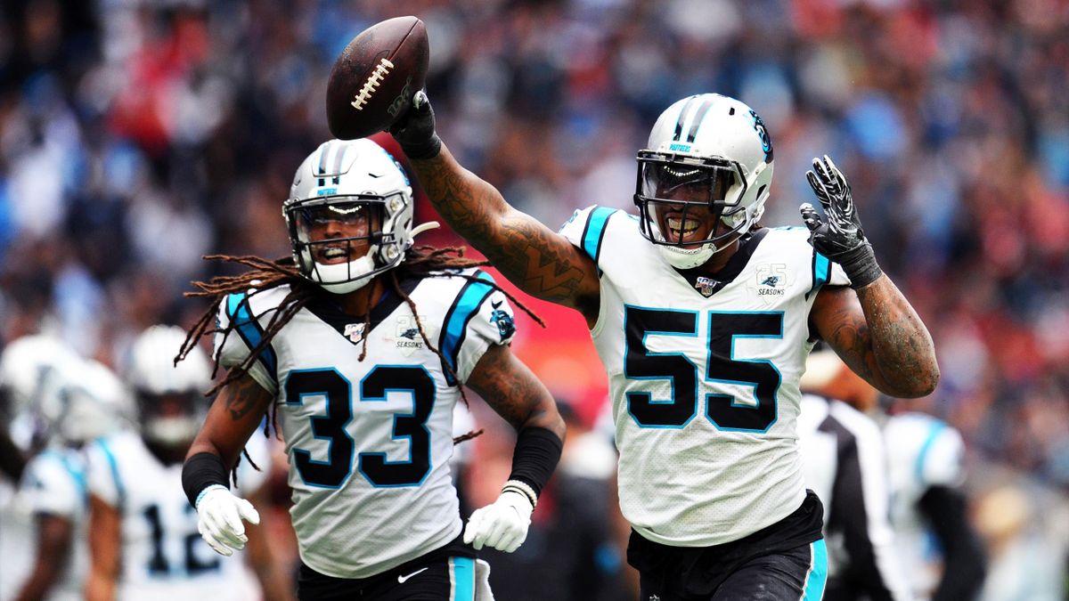 Bruce Irvin of Carolina Panthers celebrates with teammate Tre Boston during the NFL match between the Carolina Panthers and Tampa Bay Buccaneers at Tottenham Hotspur Stadium