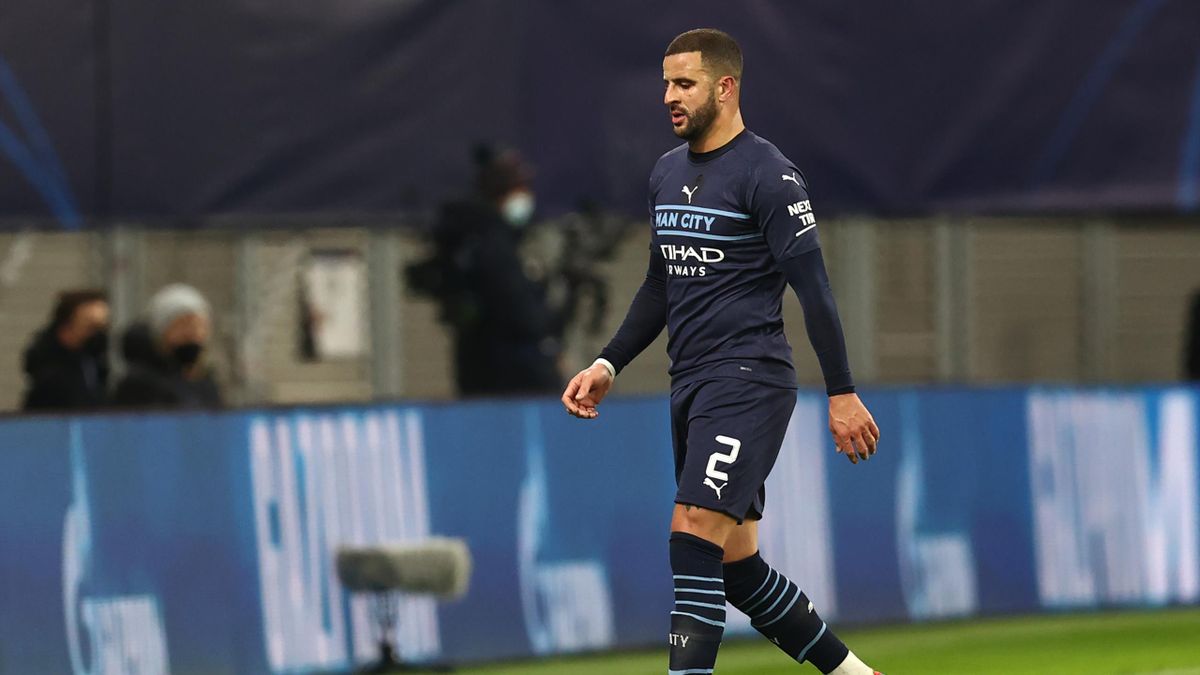 Kyle Walker of Manchester City looks dejected as he leaves the pitch after being shown a red card during the UEFA Champions League group A match between RB Leipzig and Manchester City at Red Bull Arena on December 7, 2021.