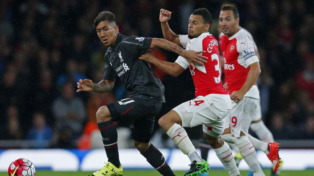 Arsenal's Santi Cazorla and Francis Coquelin in action with Liverpool's Roberto Firmino