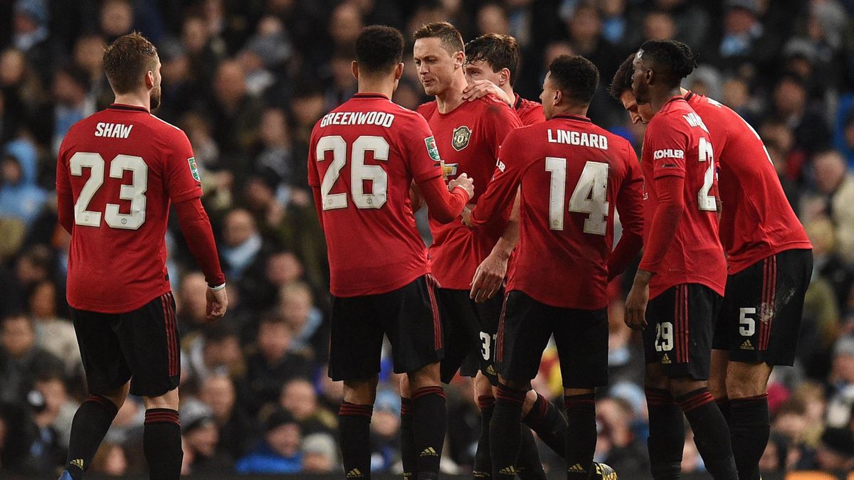 Manchester United's Serbian midfielder Nemanja Matic (C) celebrates scoring the opening goal during the English League Cup semi-final second leg football match between Manchester City and Manchester United at the Etihad Stadium in Manchester, north west E