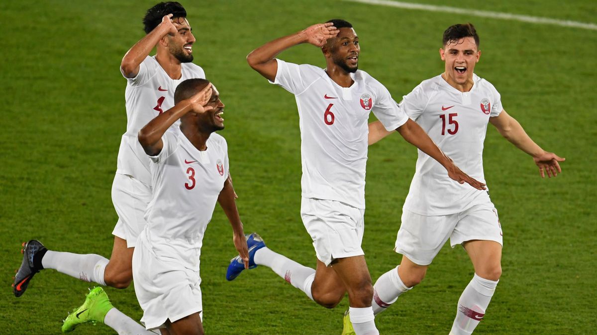 Qatar's midfielder Abdelaziz Hatim (2nd-R) celebrates with teammates during the 2019 AFC Asian Cup final football match between Japan and Qatar at the Mohammed Bin Zayed Stadium in Abu Dhabi on February 1, 2019. (Photo by Khaled DESOUKI / AFP) (Photo cred
