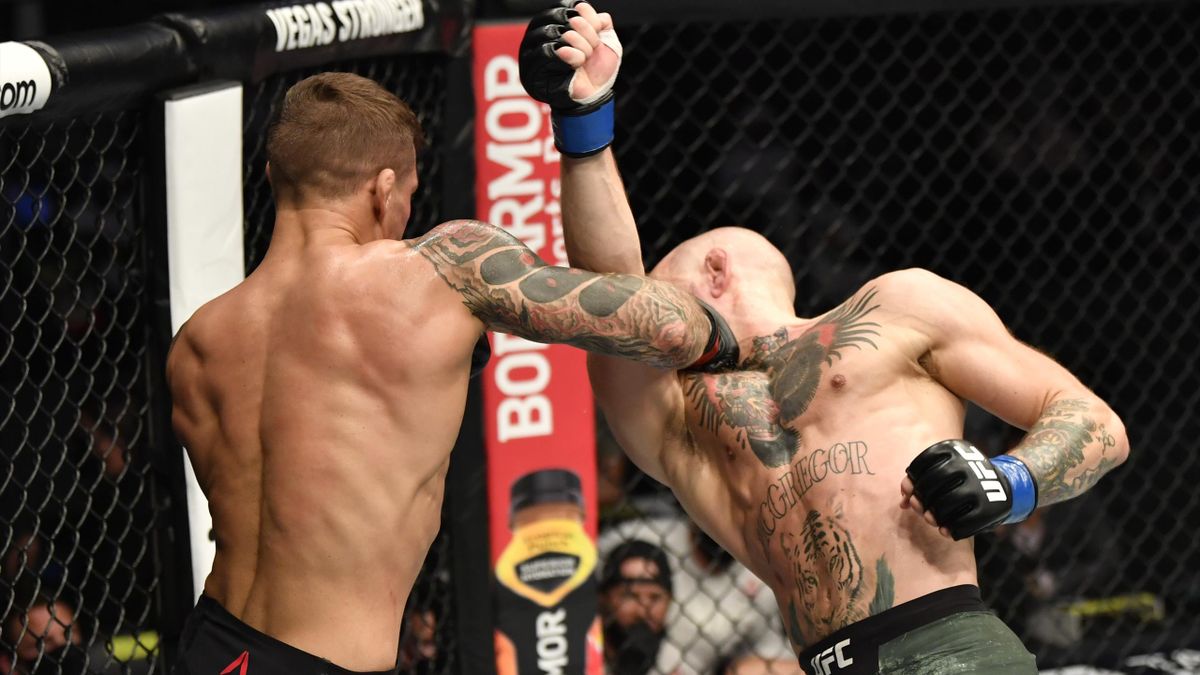 Dustin Poirier punches Conor McGregor, UFC 257, Etihad Arena, UFC Fight Island, Abu Dhabi, United Arab Emirates, January 23, 2021