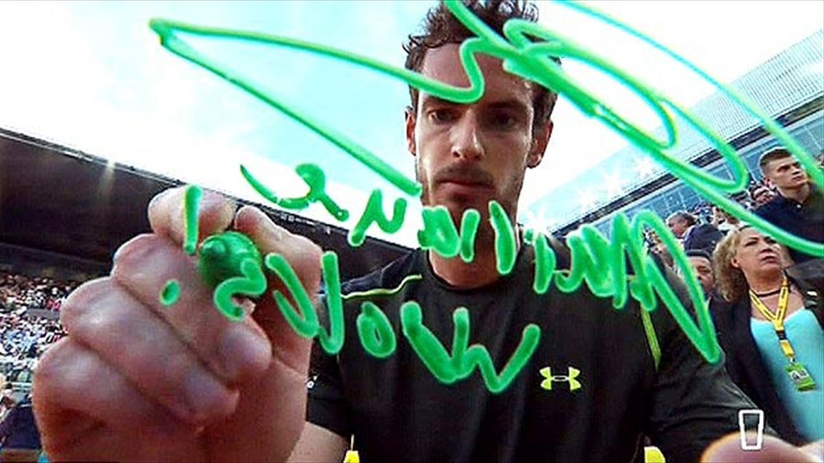 Andy Murray writes on the TV camera after beating Rafael Nadal at the Madrid Open (screenshot)