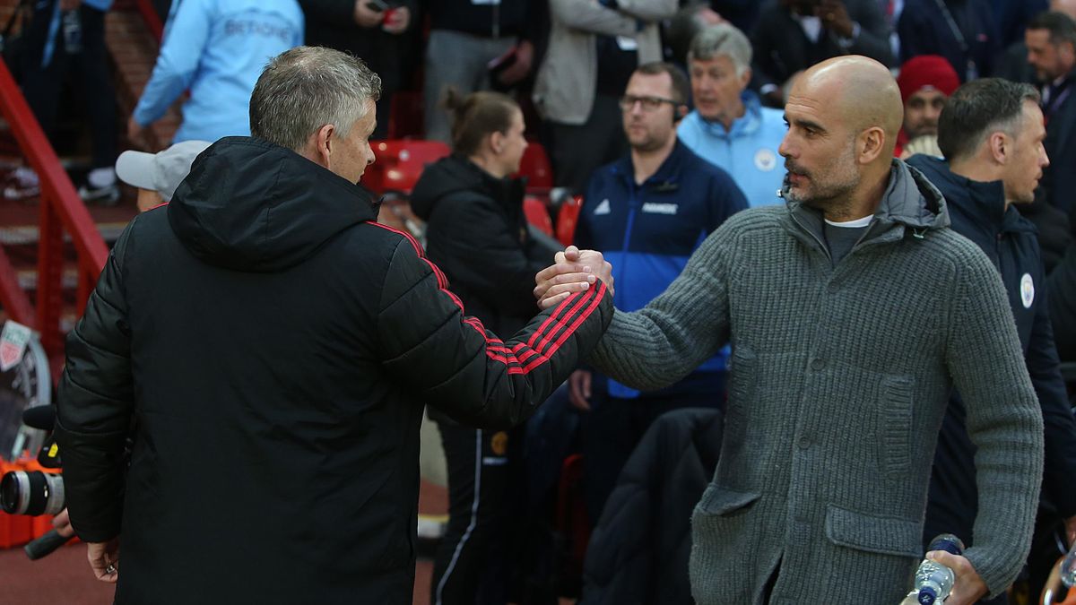 Manager Ole Gunnar Solskjaer of Manchester United greets Manager Pep Guardiola of Mancester City ahead of the Premier League match between Manchester United and Manchester City at Old Trafford on April 24, 2019 in Manchester, United Kingdom