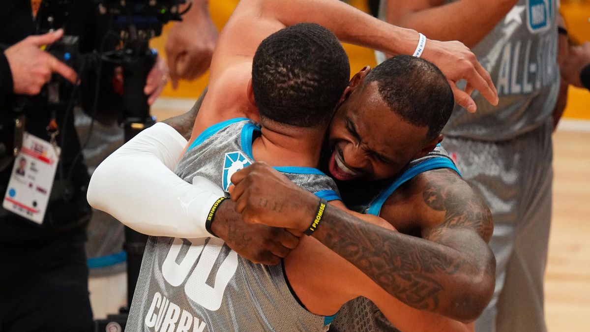 LeBron James #6 and Stephen Curry #30 of Team LeBron embrace and celebrate after winning 2022 NBA All-Star Game as part of 2022 NBA All Star Weekend on February 20, 2022