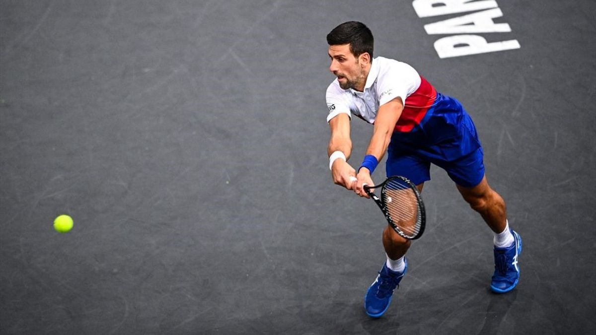 Serbia's Novak Djokovic returns the ball to US' Taylor Fritz during their men's singles quarter-final tennis match on day five of the ATP Paris Masters at The AccorHotels Arena in Paris on November 5, 2021