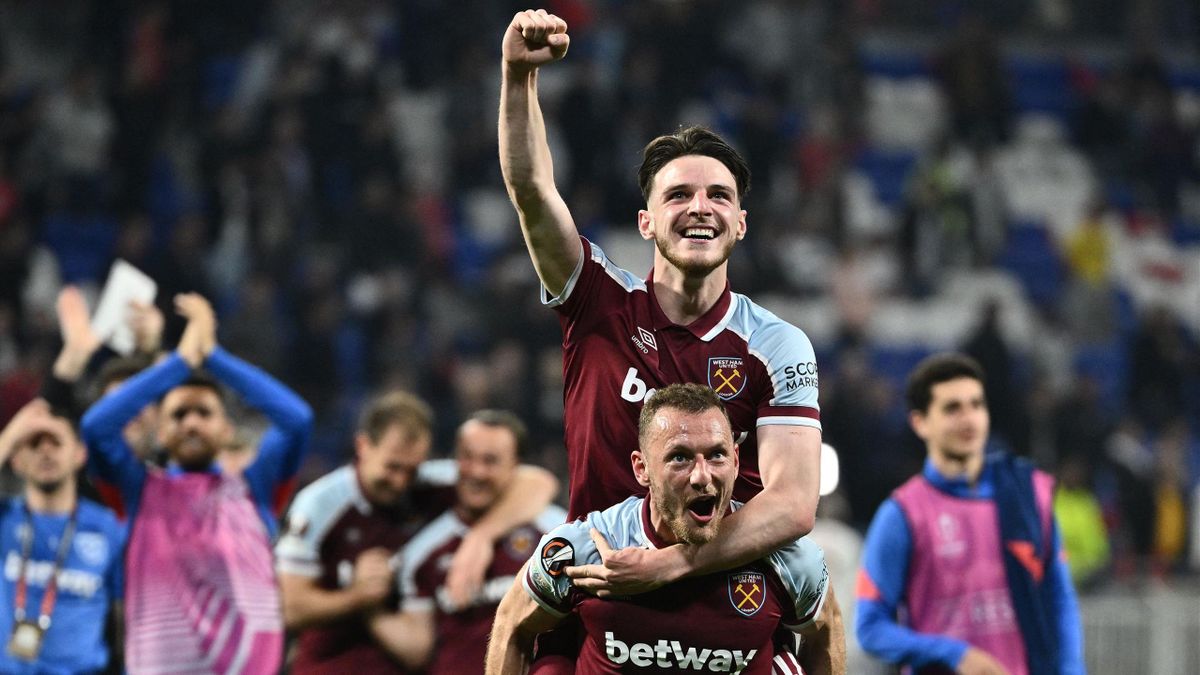 West Ham United's English midfielder Declan Rice (up) and West Ham United's Czech defender Vladimir Coufal celebrate after winning the UEFA Europa League quarter-final second-leg football match between Olympique Lyonnais (OL) and West Ham United at the Gr