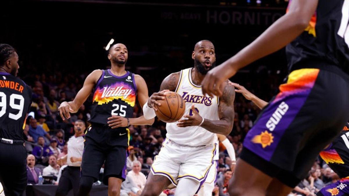 LeBron James #6 of the Los Angeles Lakers passes for his 10,000th career assist during the first half against the Phoenix Suns at Footprint Center on March 13, 2022 in Phoenix, Arizona