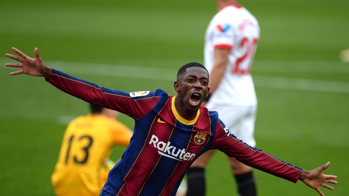Barcelona's French forward Ousmane Dembele celebrates after scoring a goal during the Spanish league football match between Sevilla FC and FC Barcelona at the Ramon Sanchez Pizjuan stadium in Seville on February 27, 2021.