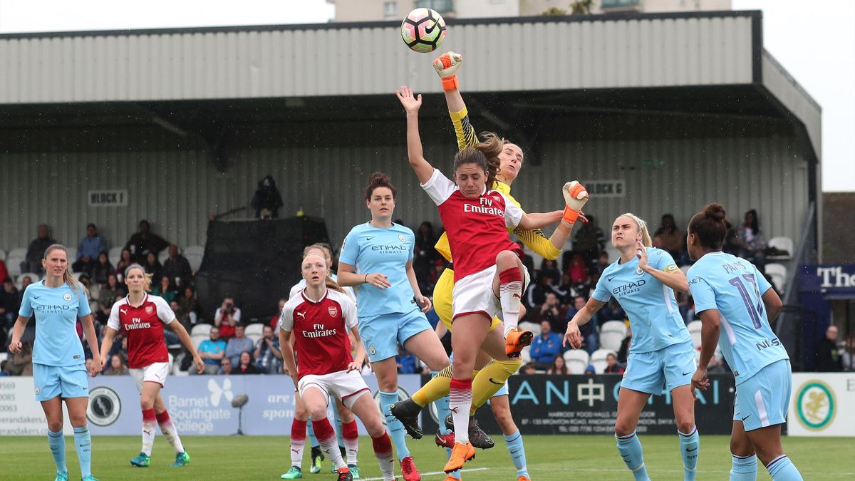Man City goalkeeper Karen Bardsley punches the ball clear from Danielle Van De Donk of Arsenal during the Womens Super League match between Arsenal Ladies and Manchester City Women at Meadow Park on May 12, 2018 in Borehamwood, England