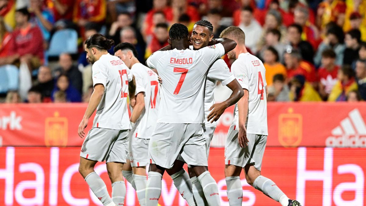 Switzerland's defender Manuel Akanji (C,R) celebrates with teammates after scoring his team first goal during the UEFA Nations League, league A, group 2 football match between Spain and Switzerland, at La Romareda stadium in Zaragoza on September 24, 2022