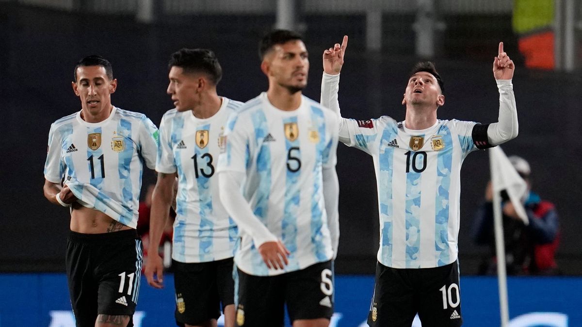 Argentina's Lionel Messi (R) celebrates after scoring against Bolivia during the South American qualification football match for the FIFA World Cup Qatar 2022 at the Monumental Stadium in Buenos Aires